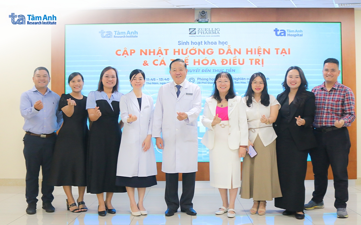 Experts and keynote speakers in a commemorative group photo following the event